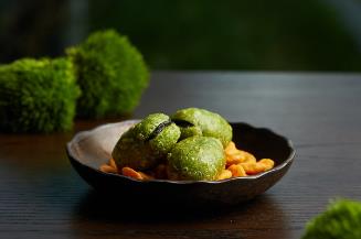 A bowl of food on a table

Description automatically generated
