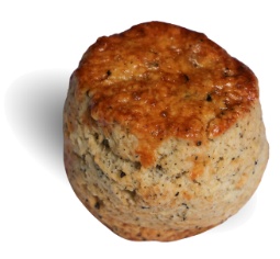 A round brown object with black specks Description automatically generated