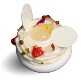 A white cake with white frosting and white eggs Description automatically generated